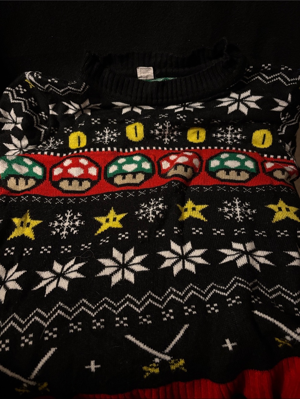 Super Mario Bros. themed ugly Christmas sweater featuring mushroom and star